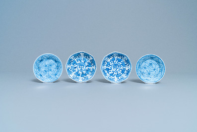 A varied collection of Chinese blue and white cups and saucers, Kangxi