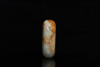 A Chinese celadon and russet jade boulder carving, Qing