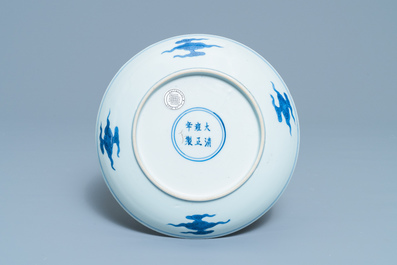 A Chinese blue and white 'dragon and Shou' dish, Yongzheng mark and of the period