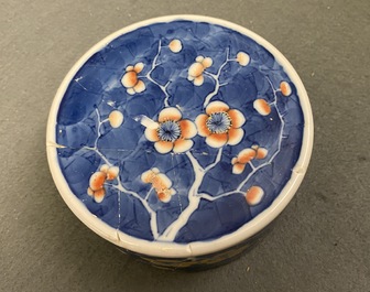 A pair of Chinese polychrome 'prunus on cracked ice' jars and covers, 19th C.