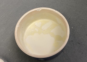 A pair of Chinese polychrome 'prunus on cracked ice' jars and covers, 19th C.