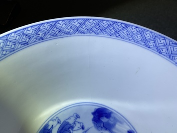 Un bol en porcelaine de Chine en bleu et blanc &agrave; d&eacute;cor de figures dans un paysage, marque et &eacute;poque de Kangxi