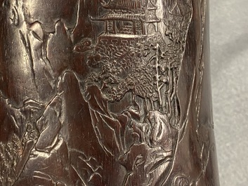 A Chinese carved zitan wood brush pot with a mountainous landscape, 17/18th C.