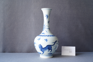 A rare Chinese blue and white bottle vase with a tiger and two butterflies, Transitional period