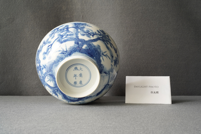 Un bol en porcelaine de Chine en bleu et blanc &agrave; d&eacute;cor de lettr&eacute;s et leurs servants, marque et &eacute;poque de Kangxi