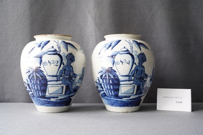 A pair of Dutch Delft blue and white tobacco jars with indians, 18th C.