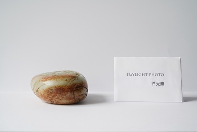 A Chinese celadon and russet jade boulder carving, Qing