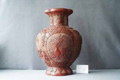 A Chinese carved red lacquer vase, Qianlong mark, 19/20th C.