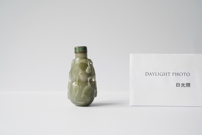 A Chinese gourd-shaped celadon and russet jade snuff bottle, Qing