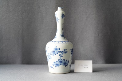 A Chinese blue and white bottle vase with floral design, Transitional period