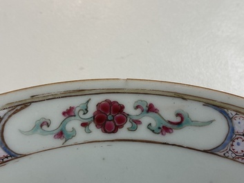 A fine Chinese famille rose ruby back plate with figures in an interior, Yongzheng