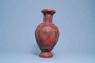 A Chinese carved red lacquer vase, Qianlong mark, 19/20th C.