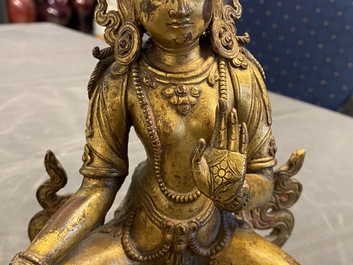 A Nepalese gilt bronze figure of White Tara, 16th C.