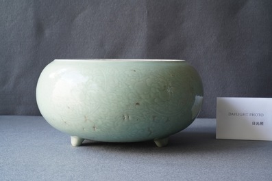 A Chinese celadon-glazed tripod censer with incised underglaze design, Kangxi