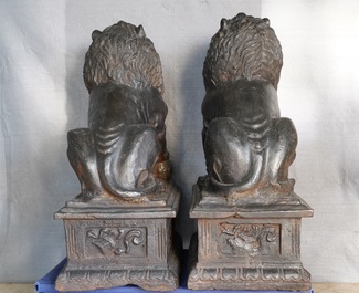 A pair of large Chinese cast iron models of lions, Ming mark and of the period