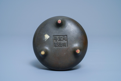 A Chinese bronze tripod censer, Xuande mark, 17/18th C.