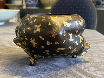 A Chinese gold-splashed bronze peach-form censer, Xuande mark, 18th C.