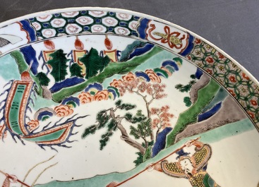 A Chinese famille verte dish with warriors on horseback, Kangxi