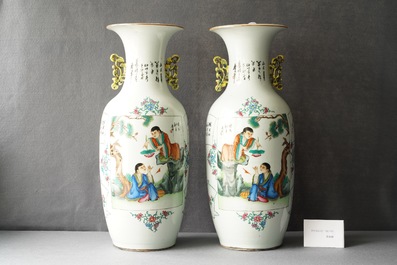A pair of Chinese famille rose two-sided design vases, 19/20th C.