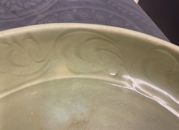 A Chinese Longquan celadon dish with incised floral design, Yuan/Ming
