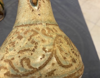 A Chinese sancai ewer and a celadon-glazed bottle vase, Tang and Song