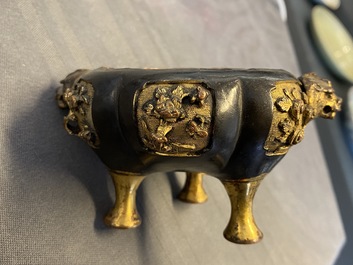 A Chinese lacquered and parcel-gilt bronze tripod censer and cover, Ming