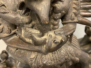 A Tibetan bronze group of Mahakala and his consort Yab-Yum, 19th C.