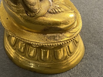 A Sino-Tibetan gilt bronze figure of Buddha, 18th C.