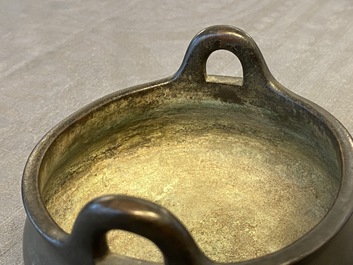 A Chinese bronze tripod censer, Xuande mark, 17/18th C.