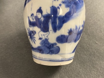 A Chinese blue and white bottle vase with figures in a landscape, Transitional period