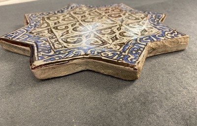 A star-shaped luster-glazed tile, Kashan, Iran, 14th C.