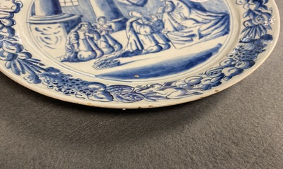 A pair of Dutch Delft blue and white plates with biblical scenes, 18th C.