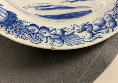 A pair of Dutch Delft blue and white plates with biblical scenes, 18th C.