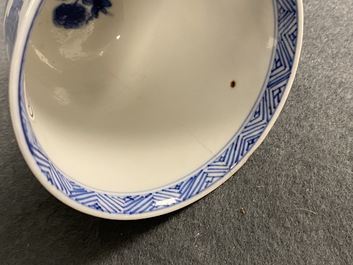 A Chinese blue and white teapot and a pair of wine cups, Kangxi