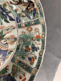 A pair of Chinese famille verte 'mythical beasts' dishes, seal marks, Kangxi