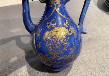 A Chinese gilt-decorated powder blue-ground jug with mythical beasts, Kangxi