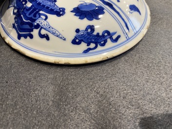 A pair of Chinese blue and white 'antiquities' bowls and covers, Kangxi