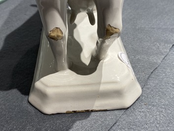 A pair of white Dutch Delftware cows on bases, 18th C.