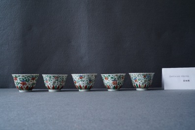 Eleven Chinese famille verte cups and thirteen saucers, Kangxi