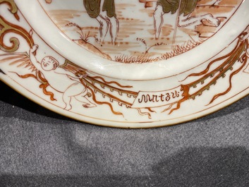 Deux assiettes en porcelaine de Chine en rouge de fer et dor&eacute; &agrave; d&eacute;cor du 'bapt&ecirc;me', Kangxi