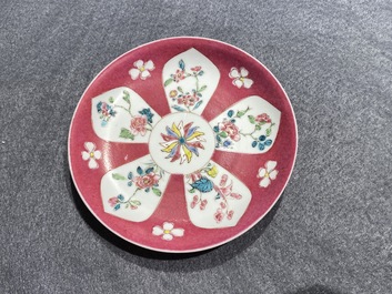 A Chinese famille rose ruby-ground cup and saucer, Yongzheng