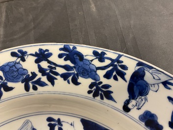 A Chinese blue and white dish with ladies around a jardini&egrave;re, Kangxi