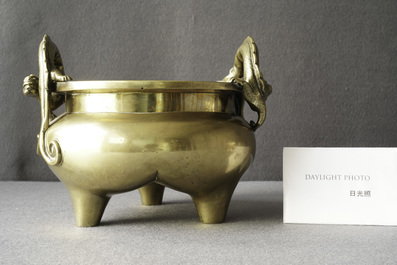 A Chinese bronze chilong-handled tripod censer, seal mark, 17/18th C.