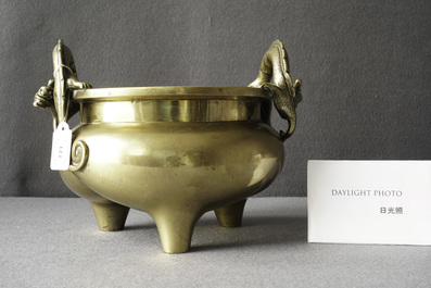 A Chinese bronze chilong-handled tripod censer, seal mark, 17/18th C.