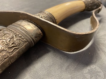 A Chinese silver, tie li mu wood and bone sword, 19th C.