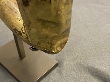 A Tibetan gilt bronze and copper alloy arm of Buddha, Ming
