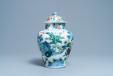 A Chinese wucai 'mythical beasts' vase and cover, Transitional period