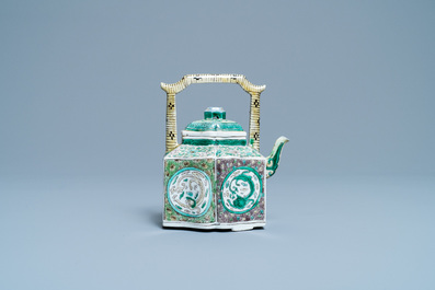 A Chinese verte biscuit teapot and cover, Kangxi