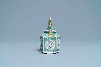 A Chinese verte biscuit teapot and cover, Kangxi