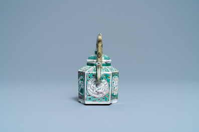 A Chinese verte biscuit teapot and cover, Kangxi